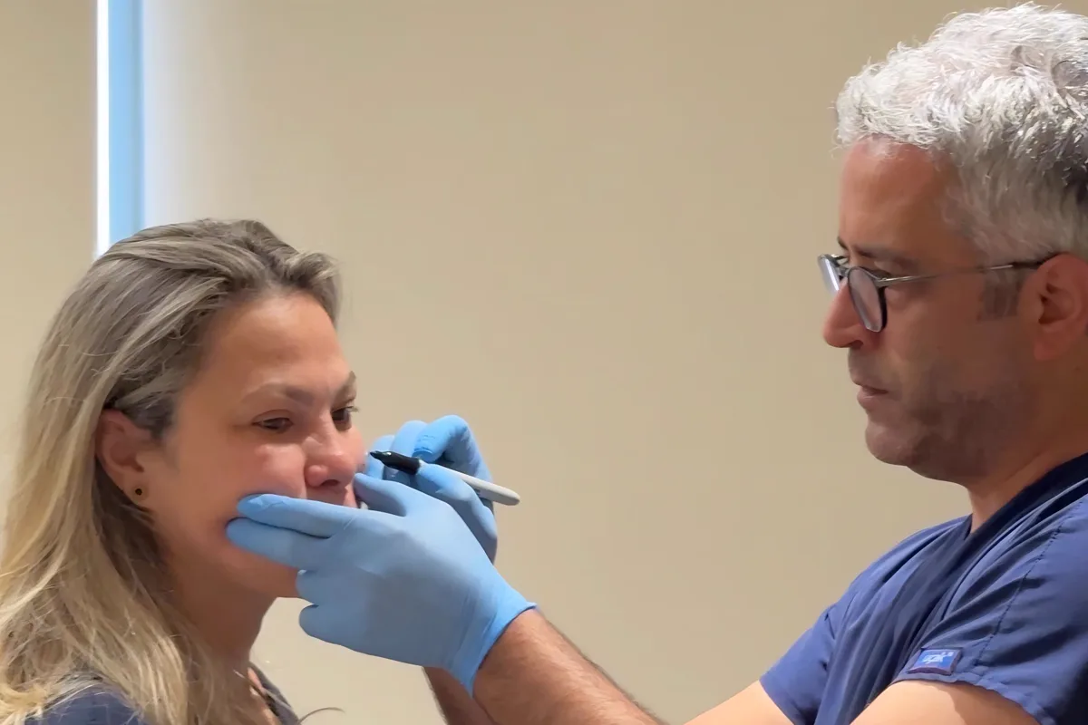 Dr. Yakup Duman planning a facelift by hand